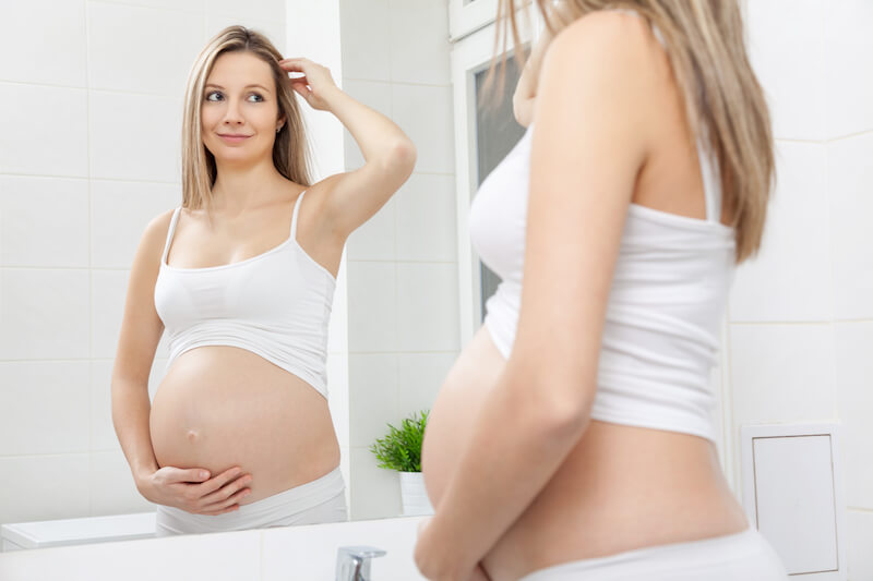Pregnant-woman-looking-in-mirror.jpg