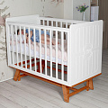 Детская кроватка Sweet Baby Nuovo с продольным маятником (Белый/Натуральный
						
					) — Фото